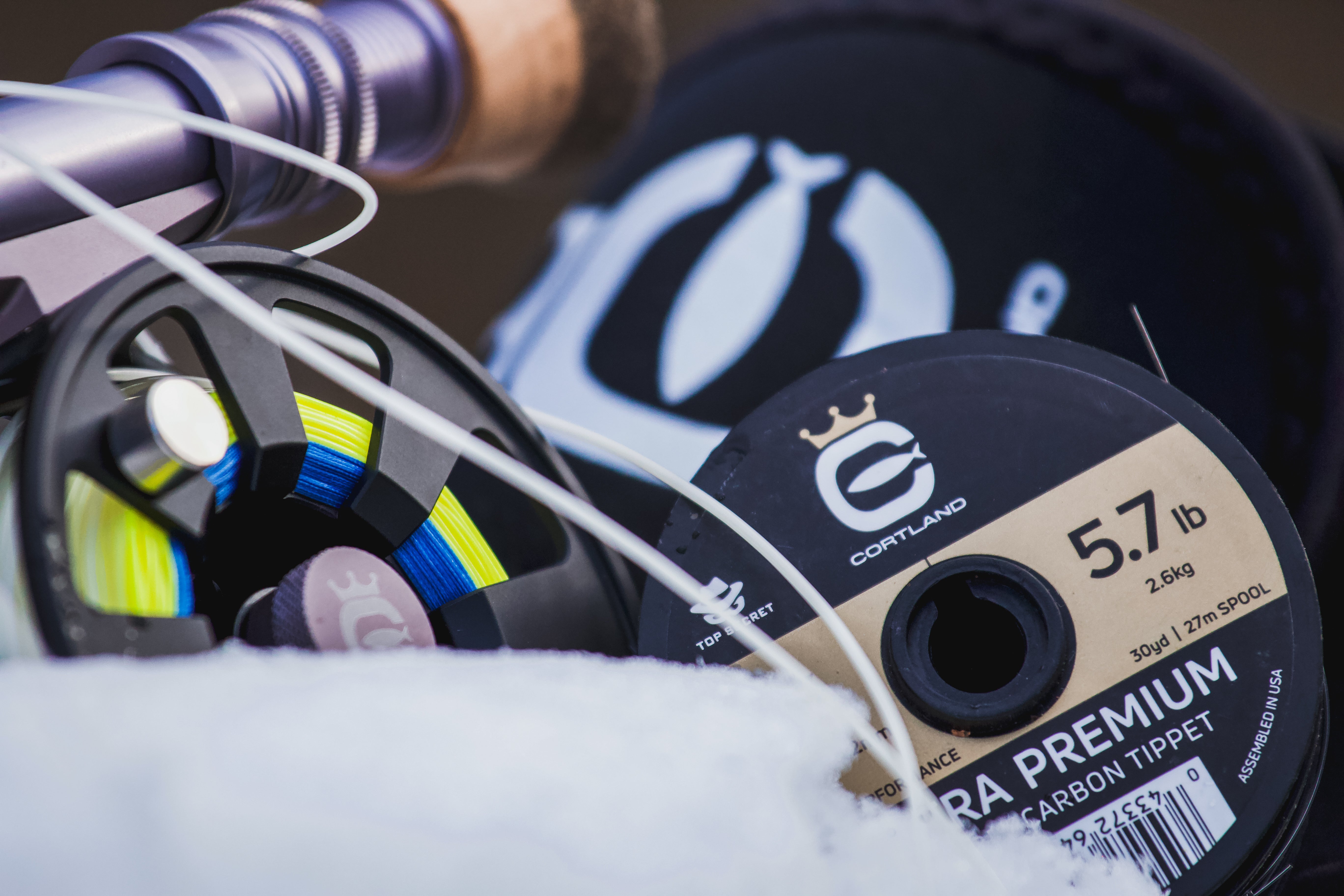 Closeup shot of a fly reel and Ultra Premium Fluorocarbon Tippet