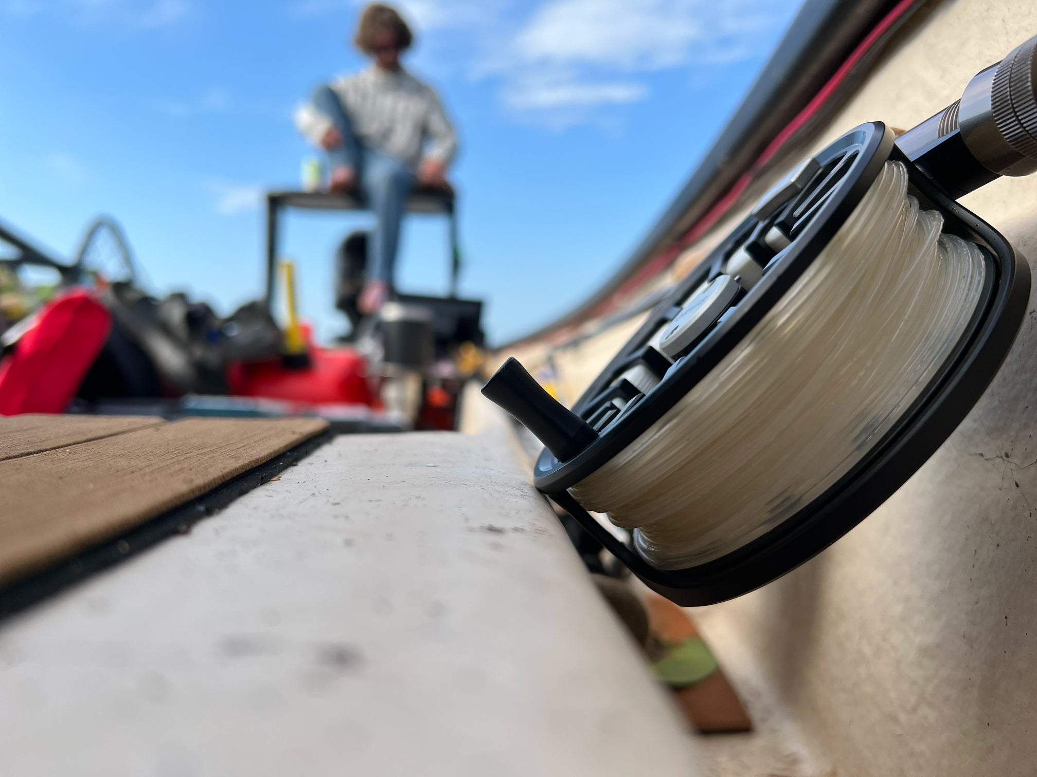 Closeup shot of a fly reel and rod