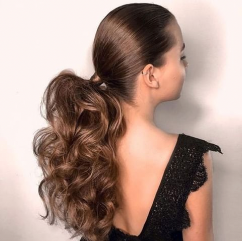 Low ponytail volumized hair