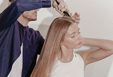 Brushing blonde long hair