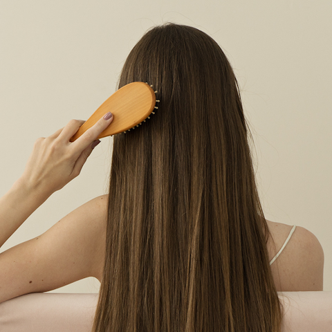 Brushing long, straight hair