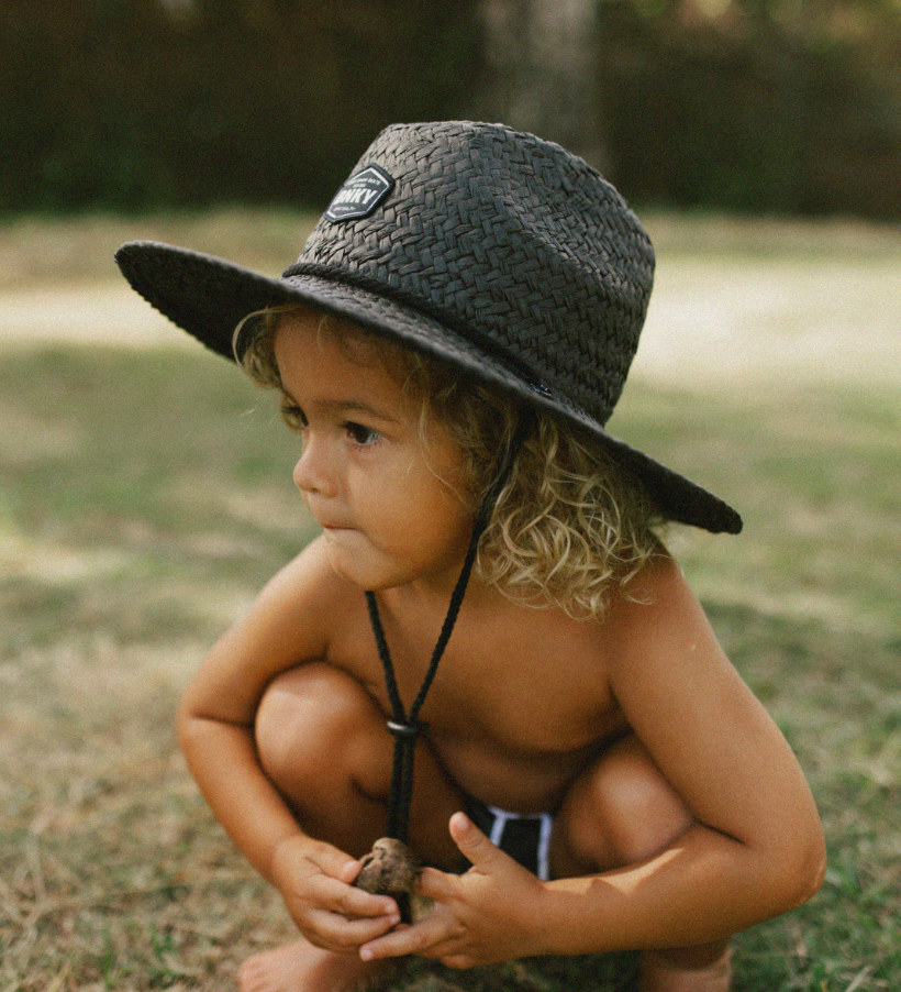 toddler wearing binky bro barney patrol sun hat