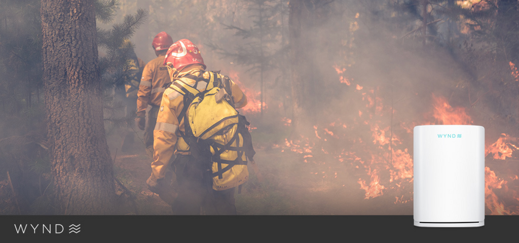 Image of firefighters fighting a wildfire and WYND Max Room Purifier