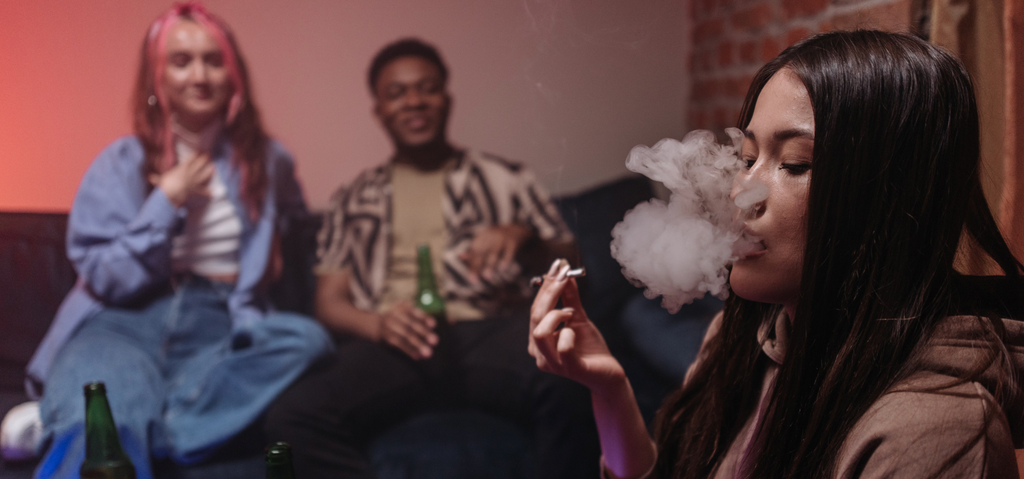 Image of guests smoking inside a home