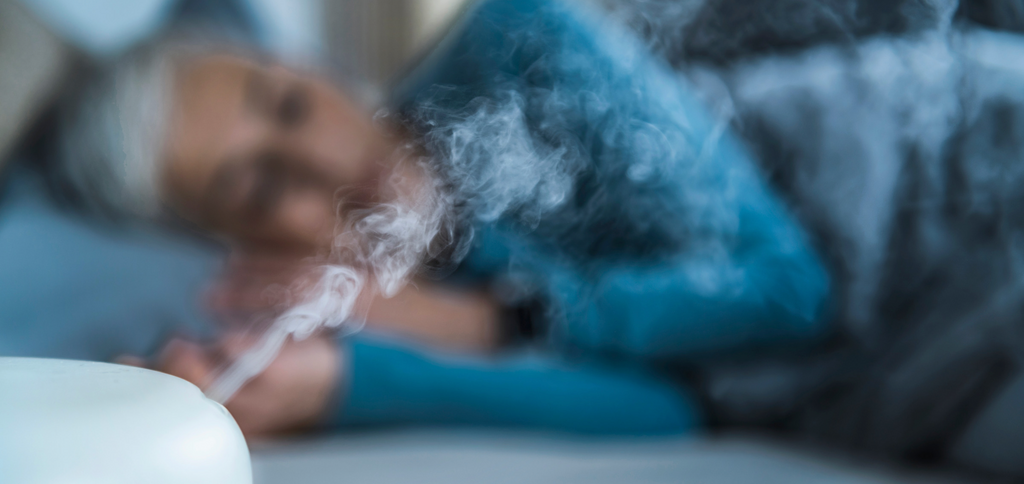 Image of woman sleeping with a humidifer