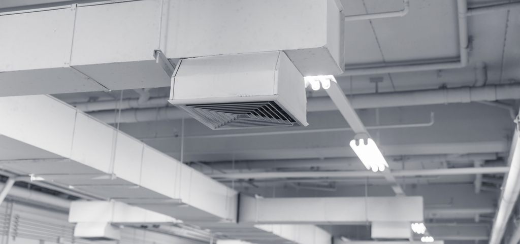 Image of traditional HVAC systems in place in ceiling of building 