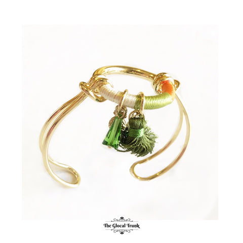 https://www.theglocaltrunk.com/products/anchor-me-tassel-bracelet-cuff-orange-green-white