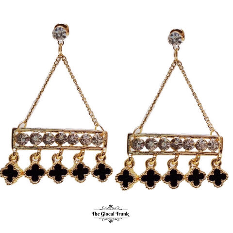 https://www.theglocaltrunk.com/products/karma-enamel-and-crystal-dangler-earrings