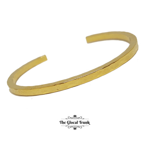 https://www.theglocaltrunk.com/products/stamped-slim-gold-cuff-bracelet