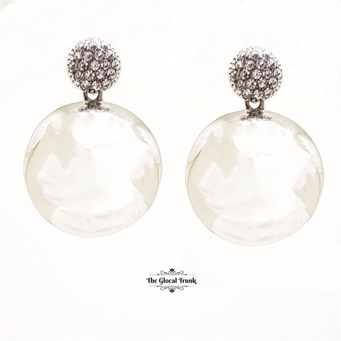 https://www.theglocaltrunk.com/products/reflect-crystal-and-gloss-metal-earrings