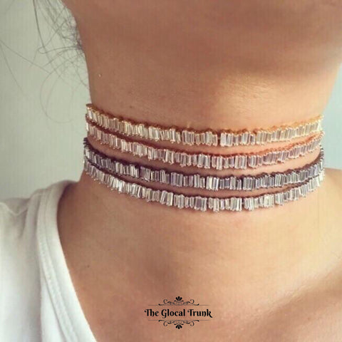 https://www.theglocaltrunk.com/products/petra-baguette-crystal-choker-grey-silver-gold-rose-gold?variant=32307465921