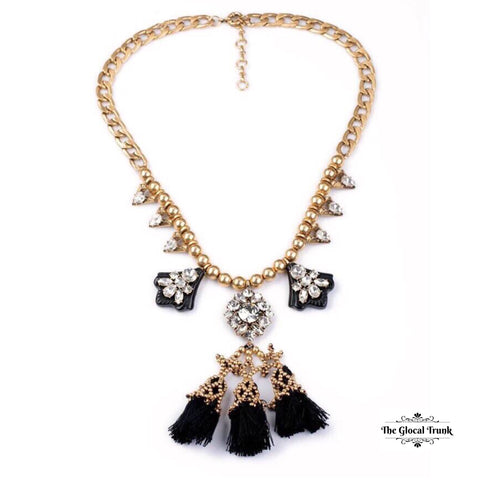 https://www.theglocaltrunk.com/products/fluid-crystal-tassel-statement-necklace