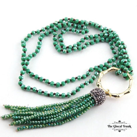 https://www.theglocaltrunk.com/products/metal-bamboo-circle-crystal-tassel-necklace-green