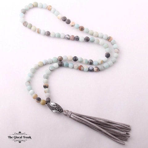 https://www.theglocaltrunk.com/products/the-amazon-stone-tassel-necklace