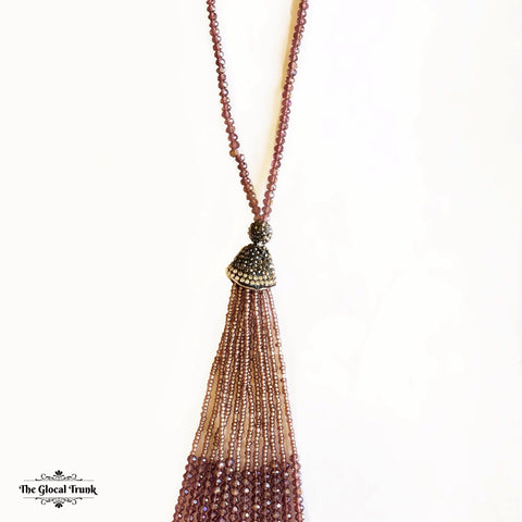 https://www.theglocaltrunk.com/products/purple-paved-tassel-necklace