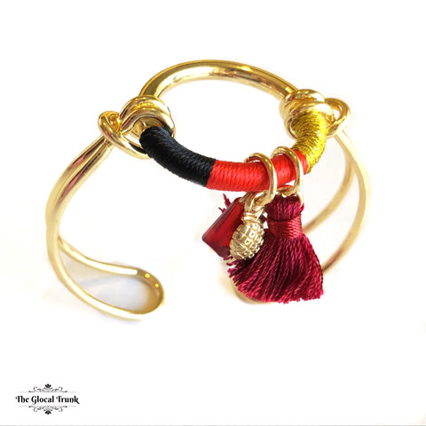 https://www.theglocaltrunk.com/products/anchor-me-tassel-bracelet-cuff-black-red-yellow