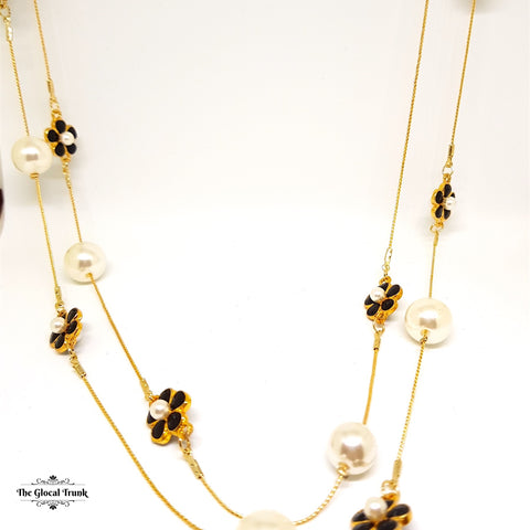 https://www.theglocaltrunk.com/products/pearl-and-black-enamel-flower-long-chain-necklace