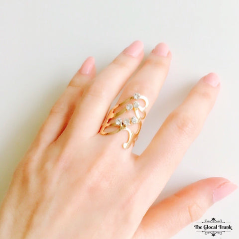 https://www.theglocaltrunk.com/products/cascade-wave-gold-ring