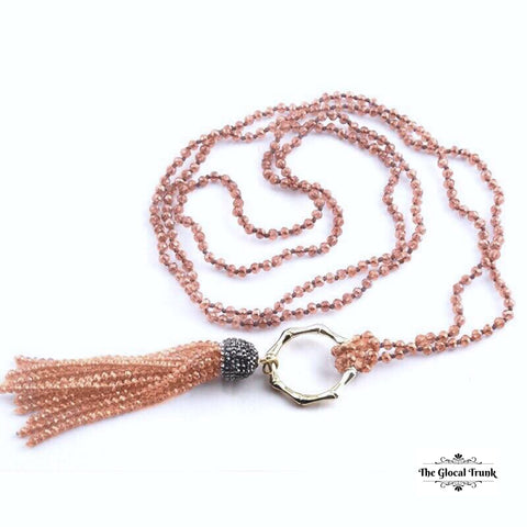 https://www.theglocaltrunk.com/products/metal-bamboo-circle-crystal-tassel-necklace-nude