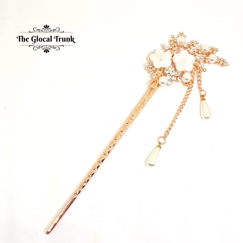 https://www.theglocaltrunk.com/products/crystal-and-rose-gold-floral-hair-bun-stick-baby-pink