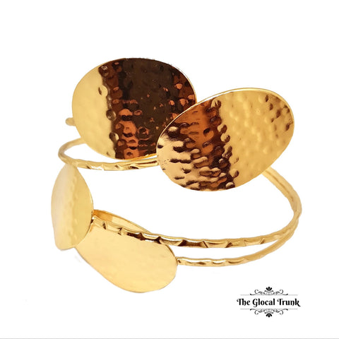 https://www.theglocaltrunk.com/products/aura-stamped-metal-armlet-armband-gold