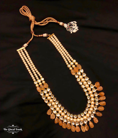 https://www.theglocaltrunk.com/products/rani-kundan-pearl-and-stone-drop-necklace