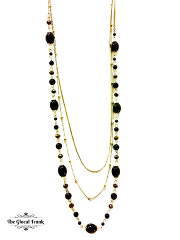 https://www.theglocaltrunk.com/products/antique-black-bead-multichain-necklace