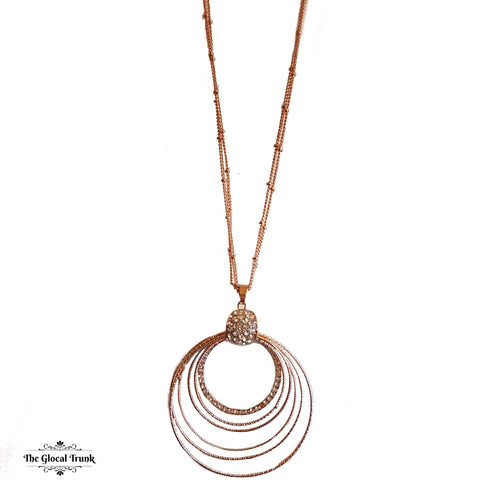 https://www.theglocaltrunk.com/products/concentric-rose-gold-and-crystal-long-chain-necklace