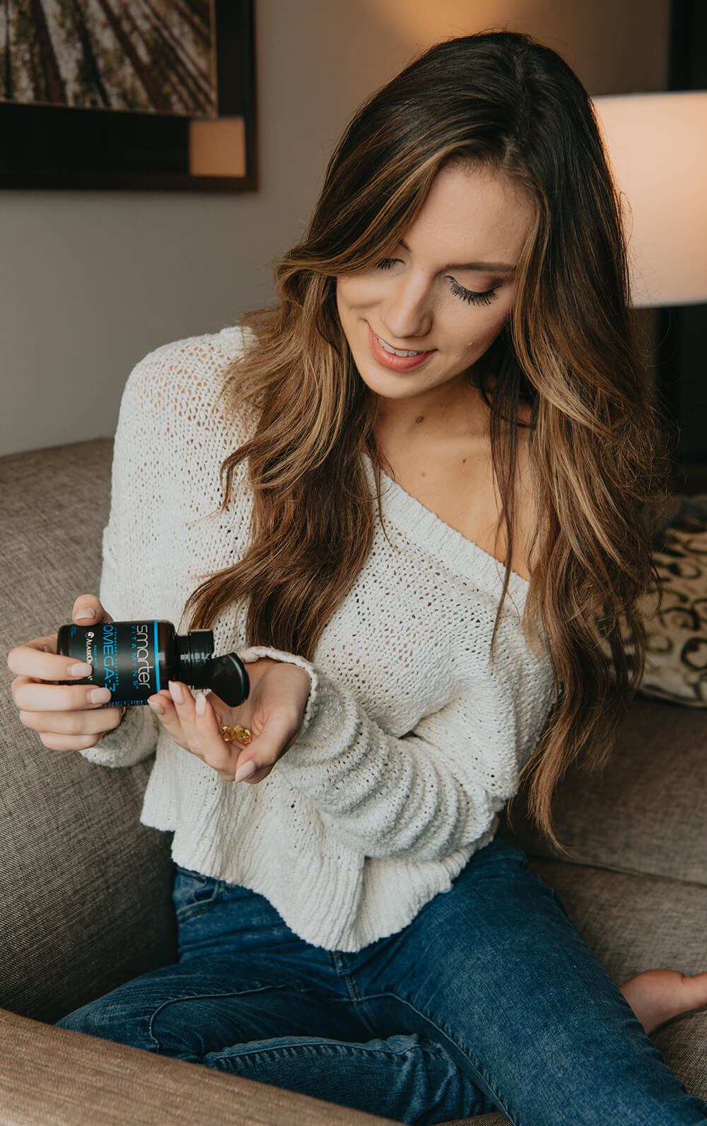 Woman pouring Smarter Omega into her hand