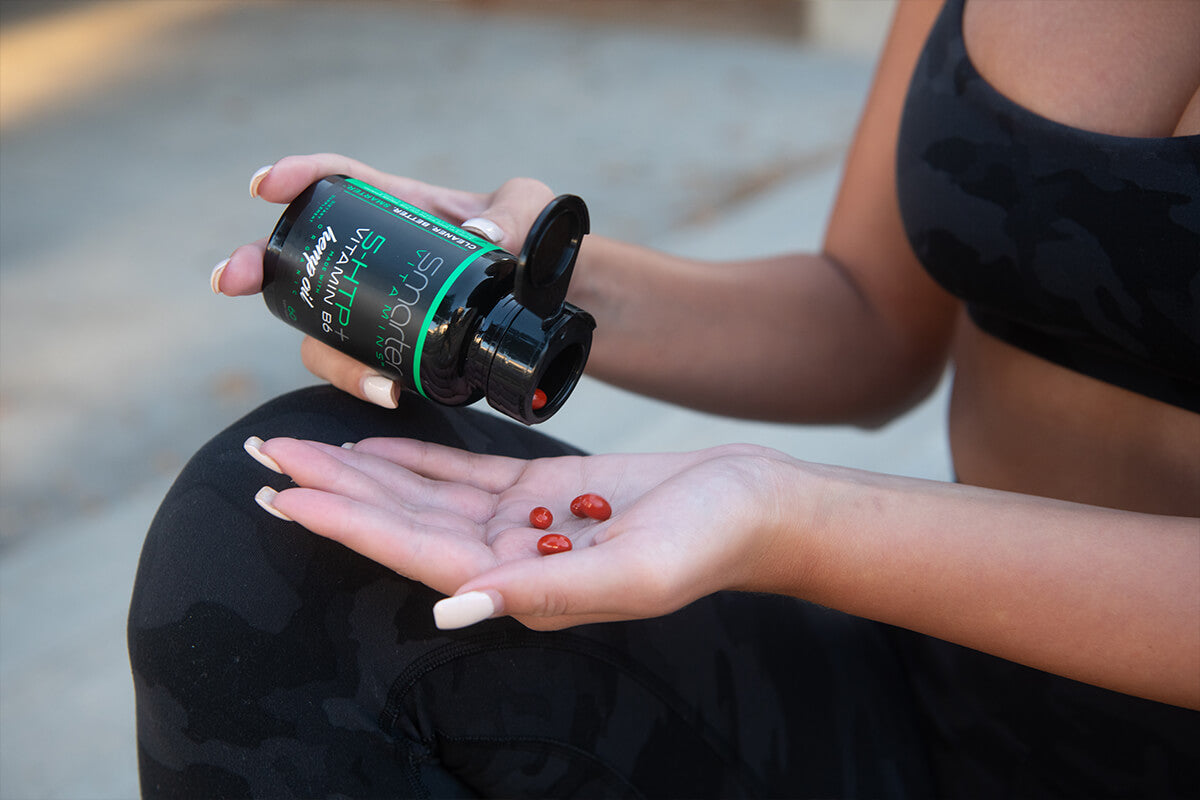 Woman pouring Smarter 5HTP Vitamin B6 into hand