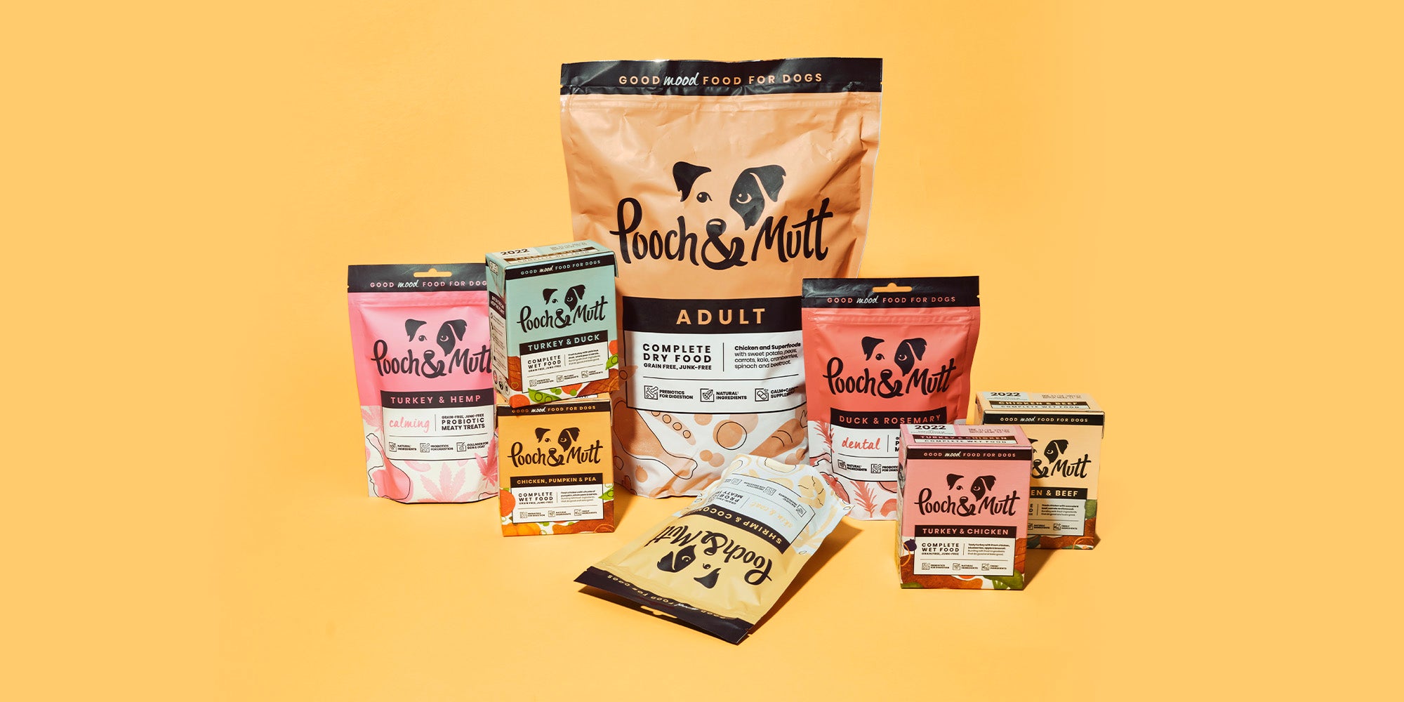 A range of Pooch & Mutt grain-free products on a pale orange background