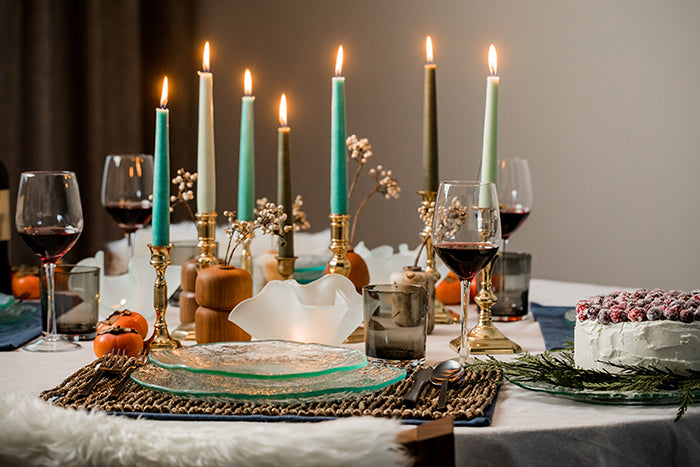 Hanukkah table setting with candles and Annieglass salt collection