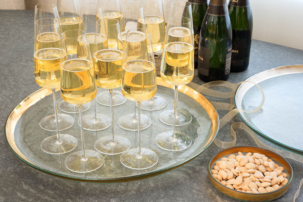 Annieglass round platter, 24k gold bank with champagne glasses