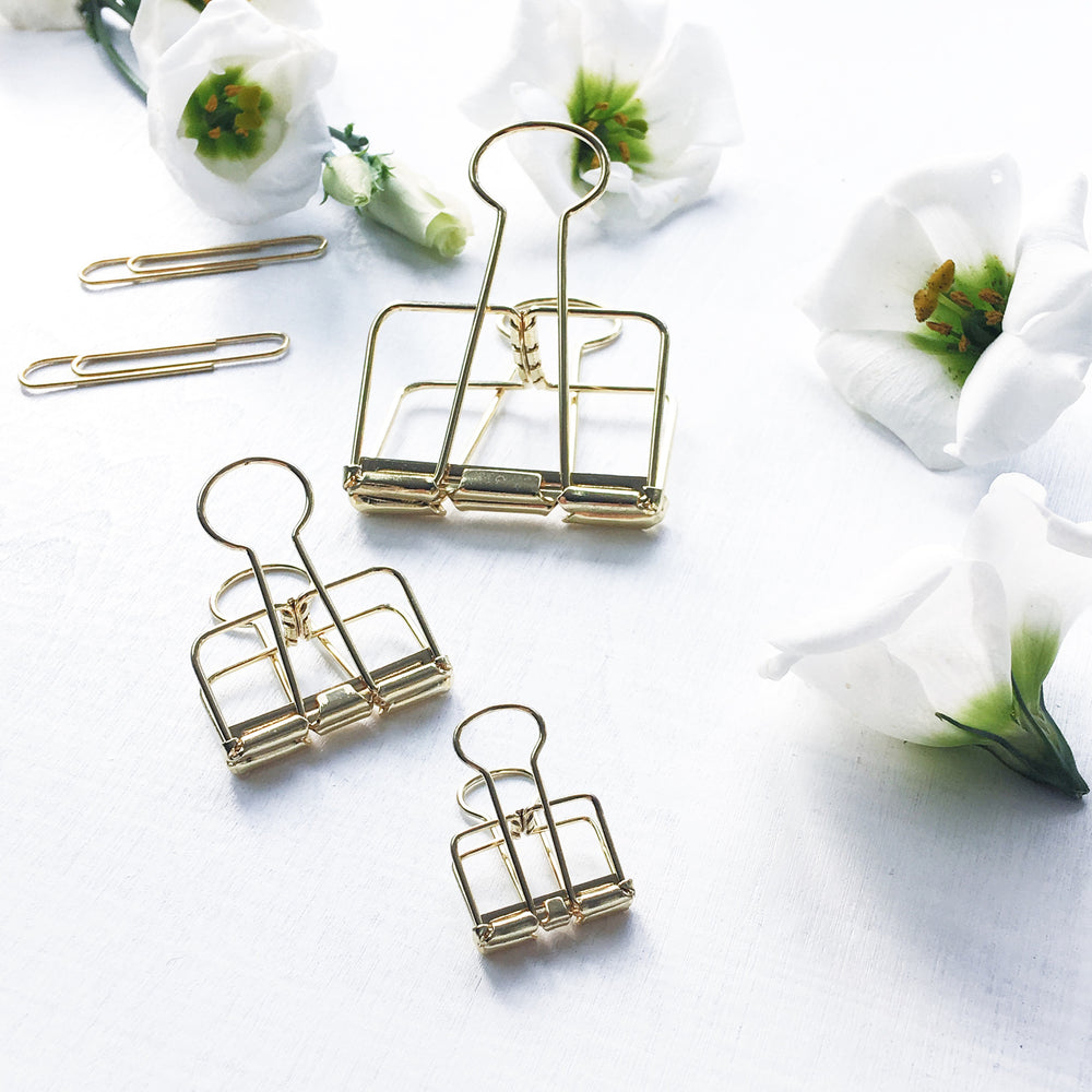 large gold binder clips