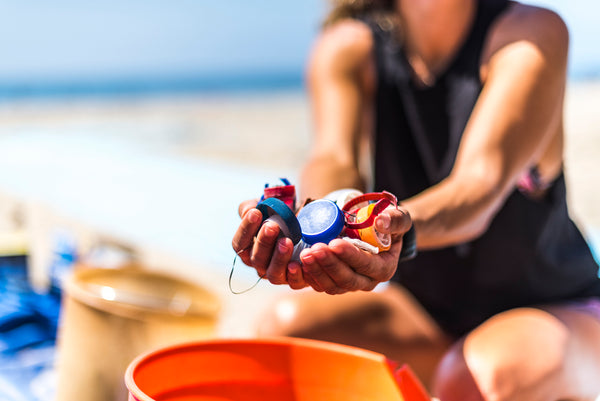 Surfrider Foundation Beach Clean-up Woman Holding Plastic Bottle Caps