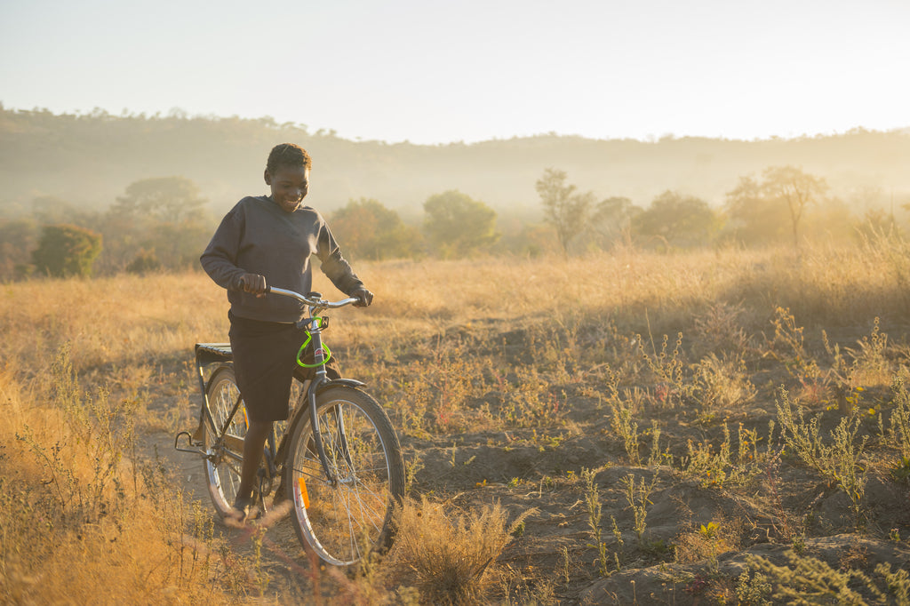 Kids riding bikes in Zambia