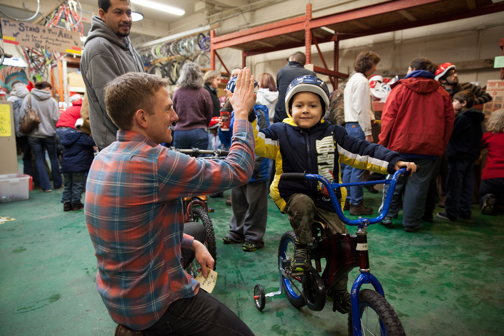MiiR Employee Josh Stinger gives a high five at the Boise Bicycle Project