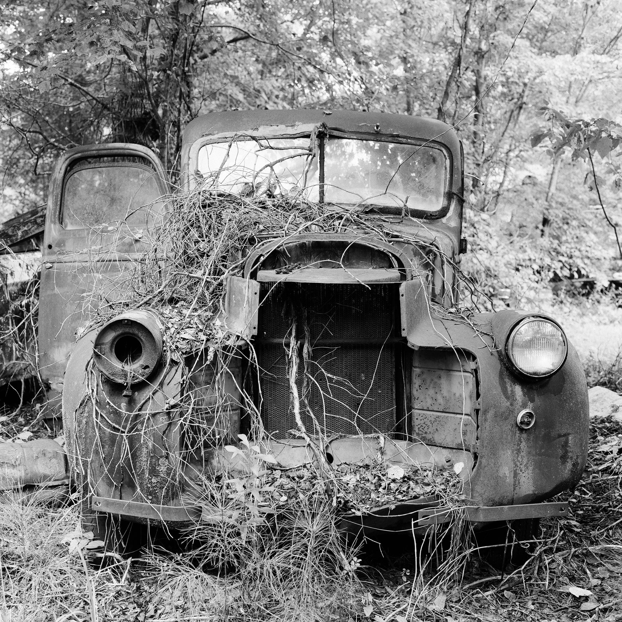 Rusty Junkyard Truck - Black and White Photograph by Keith Dotson. Buy a fine art print.