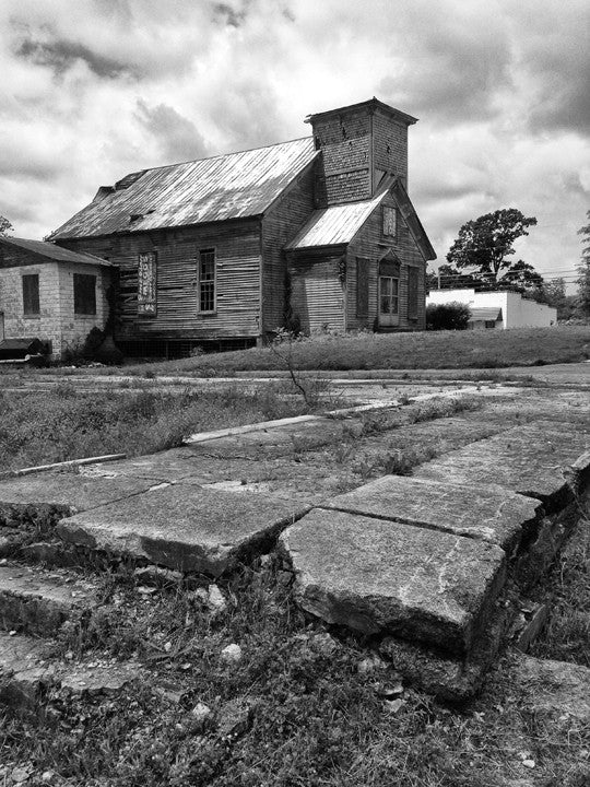 Abandoned Church and Broken Sidewalk in Adams, Tennessee