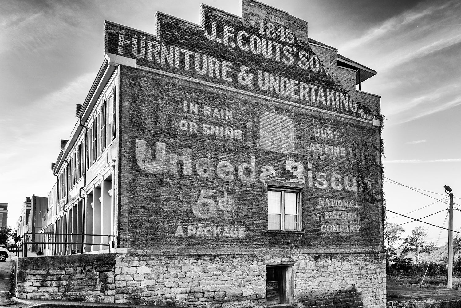 Uneeda Biscuit Ghost Sign in Clarksville Tennessee - Black and White Photograph by Keith Dotson. Click to buy a fine art print.