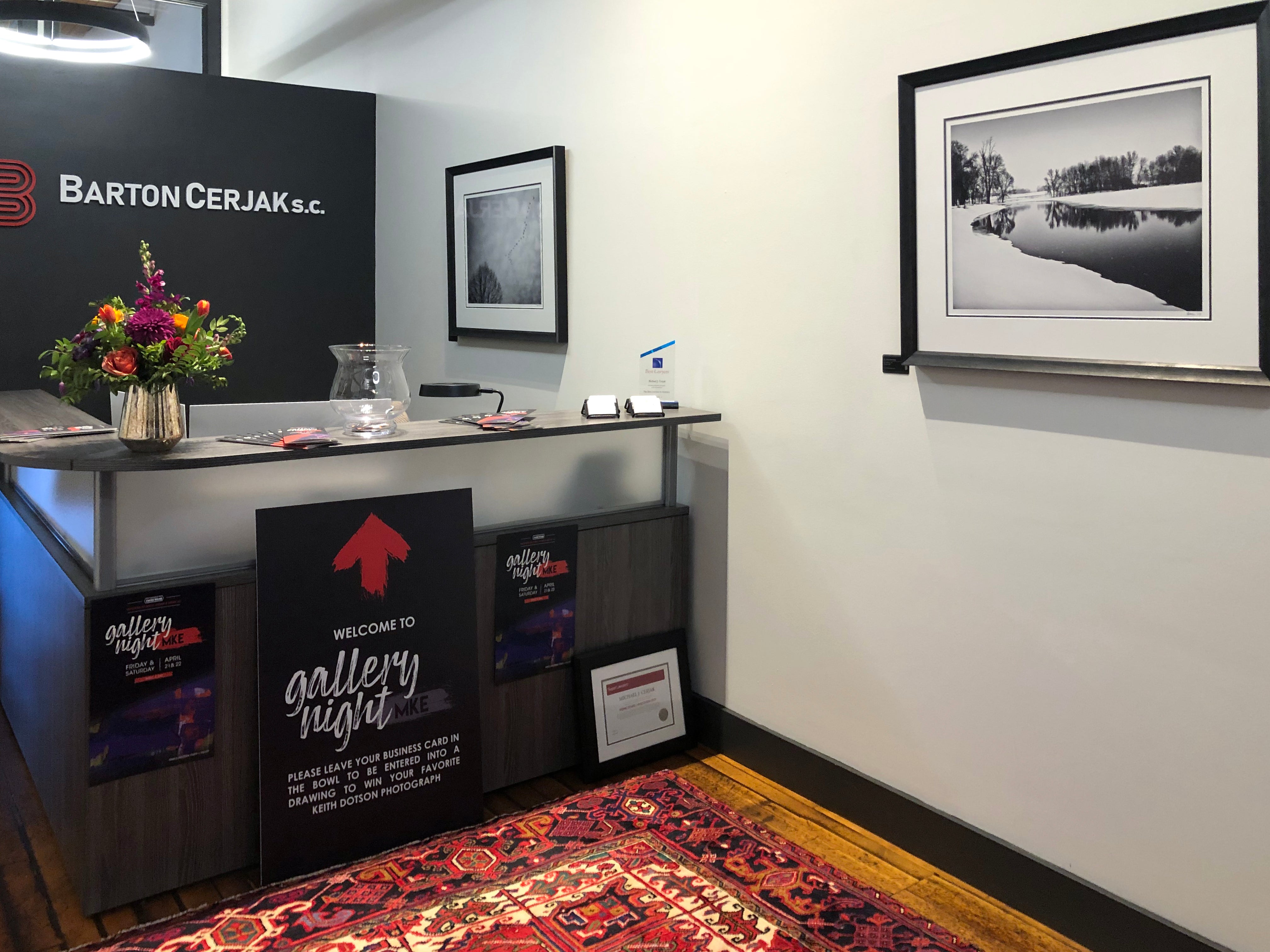 Reception area of Milwaukee law firm Barton Cerjak S.C. featuring two framed black and white photographs by Keith Dotson