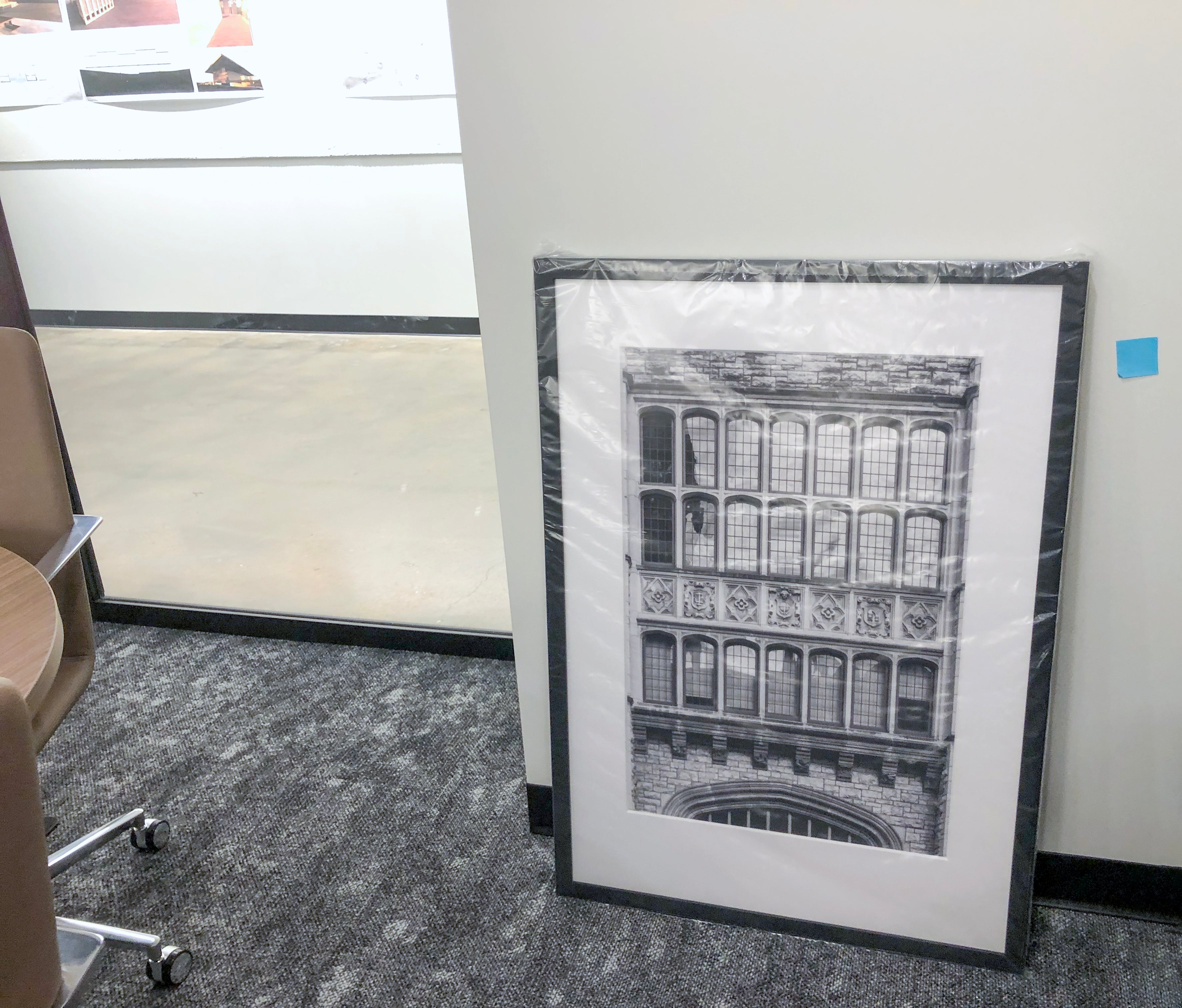 Keith Dotson's 20 x 30 inch print of the facade of Nashville's historic Hume-Fogg Academy in a black gallery frame with 8-ply white mat, waiting to be hung on the wall at O'More College of Architecture and Design at Belmont University