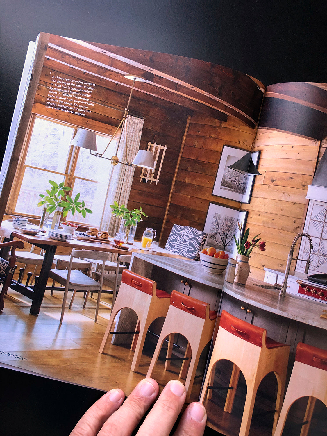 A spread for Cozy Cabins & Retreats shows two Keith Dotson landscape photographs. Interior design by Lisa Hilderbrand. Photographs by John Bessler.