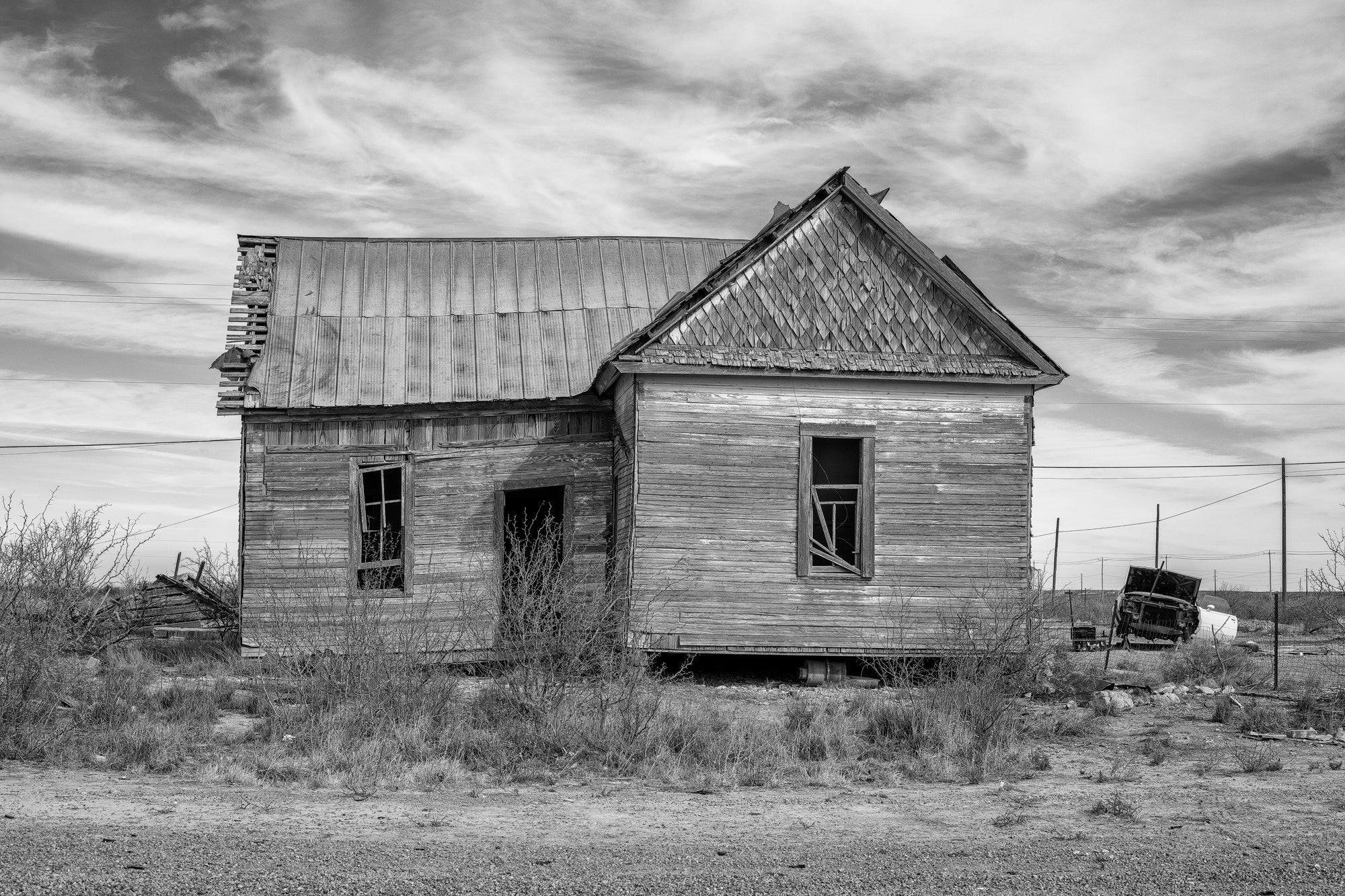 Abandoned House in a Small Town. Black and White Photograph by Keith Dotson