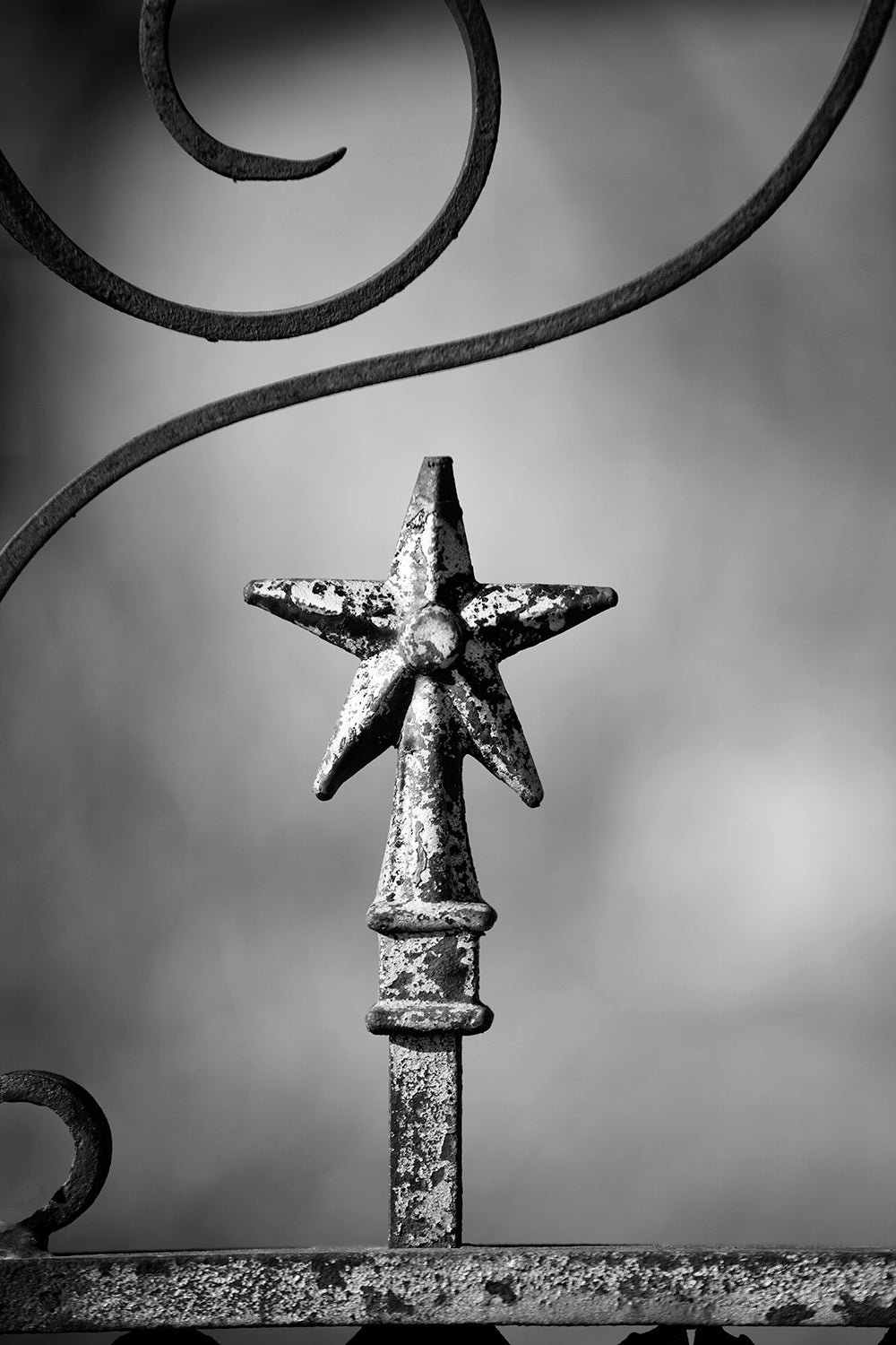 Lone Star Finial on an Old Fence in West Texas: Black and White Photograph by Keith Dotson. Click here to buy a fine art photograph.