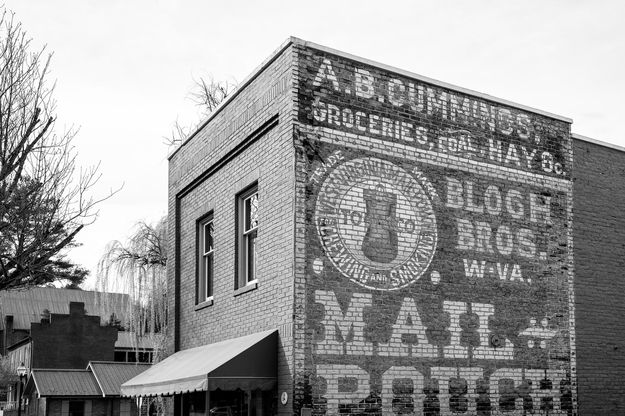 Black and white photograph of the historic Mail Pouch ghost sign in Jonesborough, Tennessee