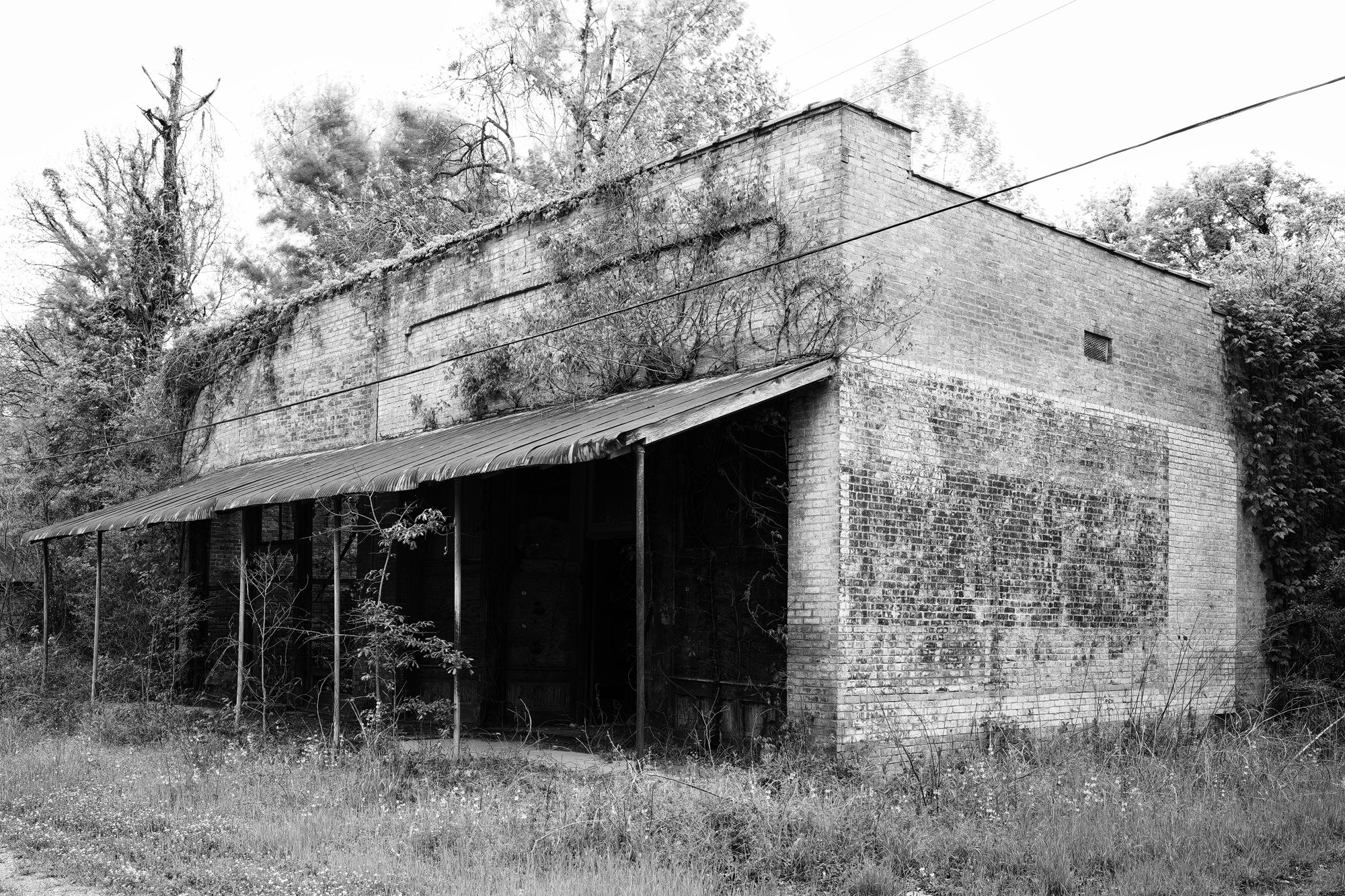 Ruins of Tibbs' Store in Hushpuckena, Mississippi - Black and White Photograph by Keith Dotson. Buy a fine art print.