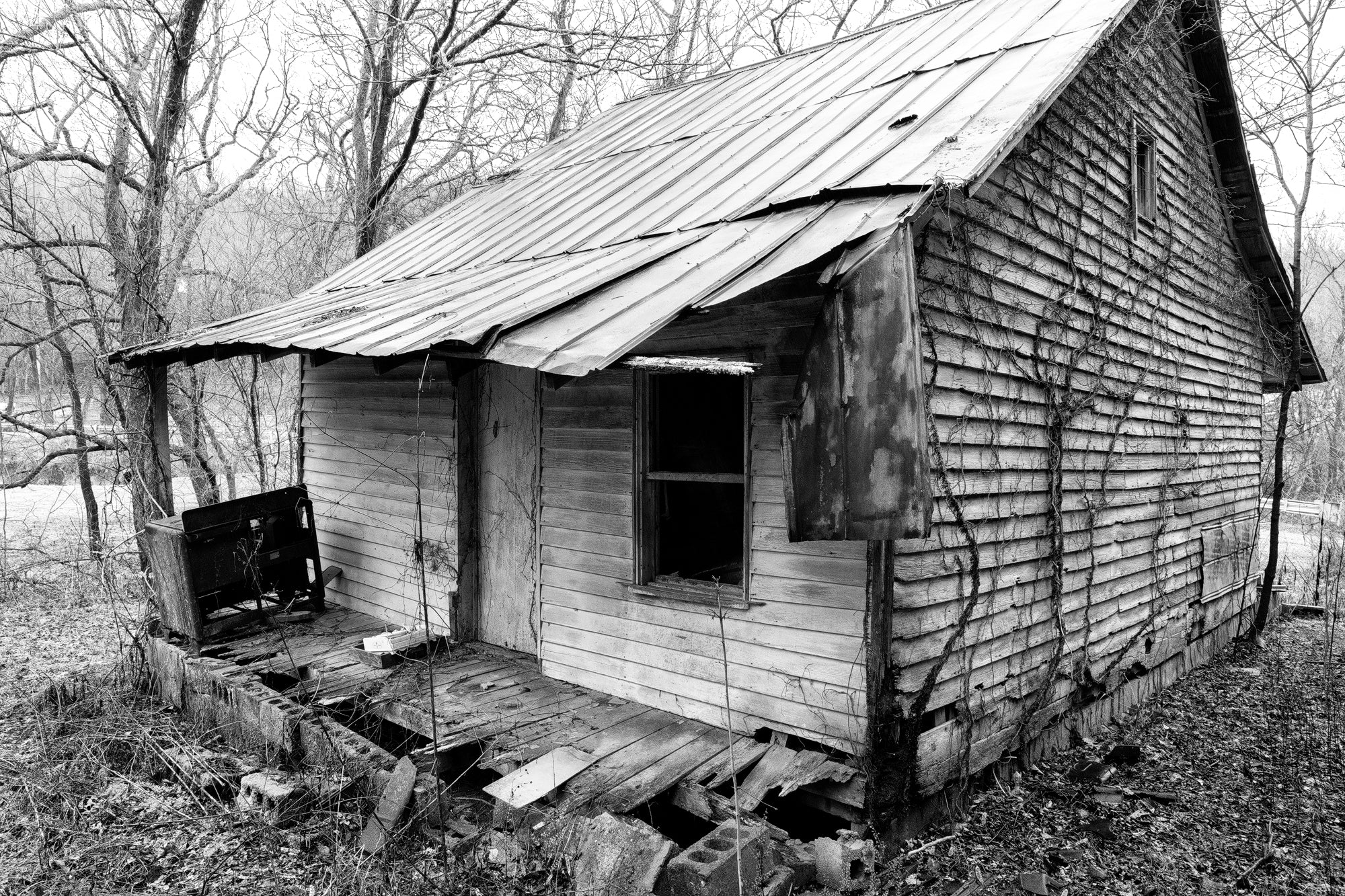 Back porch of an abandoned farmhouse in the American South