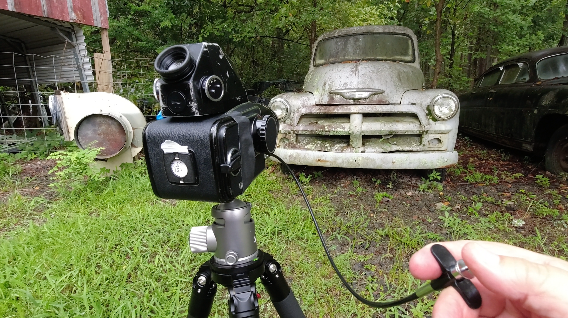 Behind-the-scenes photograph of Keith Dotson's Hasselblad on location in the junkyard, which is located in the southern United States