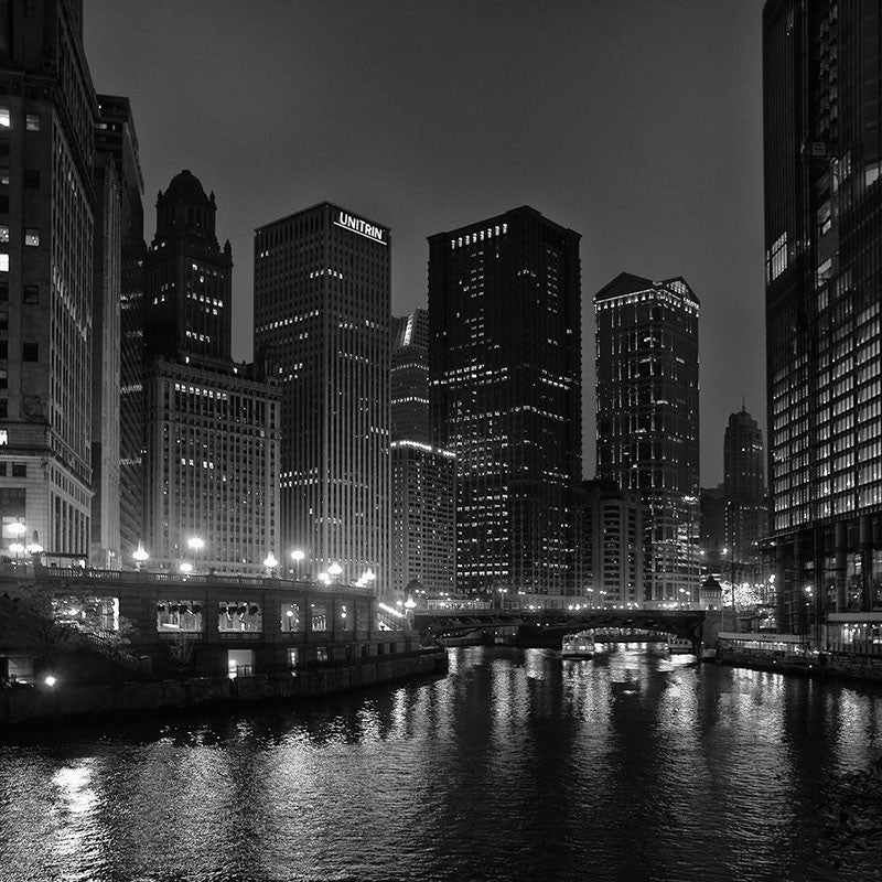 What is the title of this picture ? Chicago River at Night, black and white night photograph of downtown C